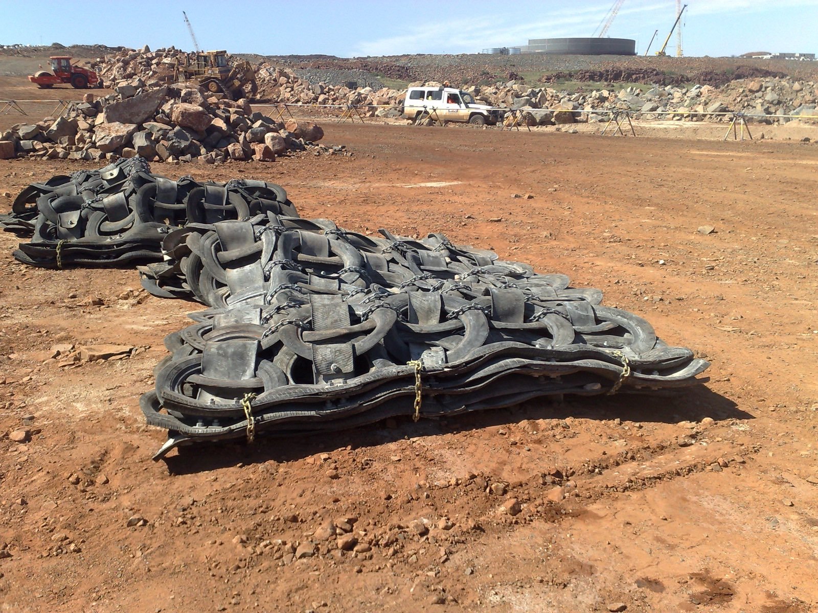 Blast mats laid over a charged blast.